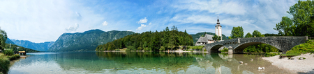 Reflection of the Holy spirit Church, lake Bohinj Slovenia. Panorama.の写真素材