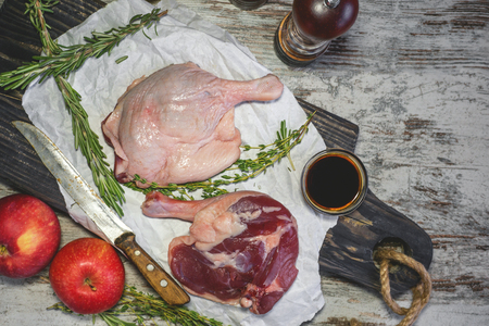 Duck legs cooked in a marinade with rosemary in the bowl of an olive tree. Step-by-step. Copy the place. The horizontal frame.の写真素材