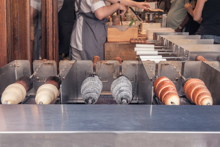 Manufacturer trdelnik in a cafe on the streets of Prague. Selective focus.の写真素材