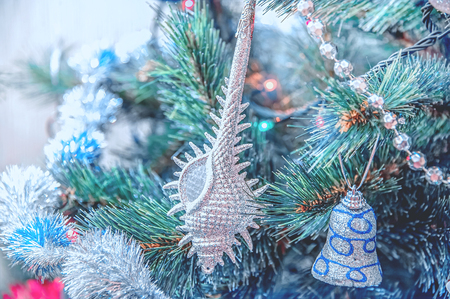 Beautiful Christmas jewelry lies on a table in a white wooden box.の写真素材