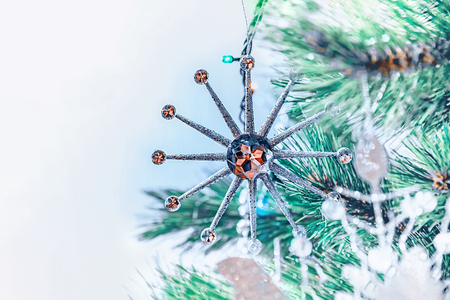 Beautiful Christmas decorations in the shape of a large white Christmas star hanging on a Christmas tree.の写真素材