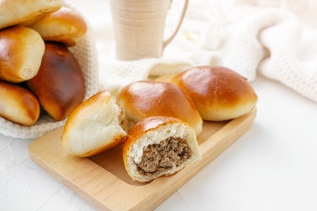 Freshly baked fragrant homemade small meat patties with an appetizing crust.の写真素材