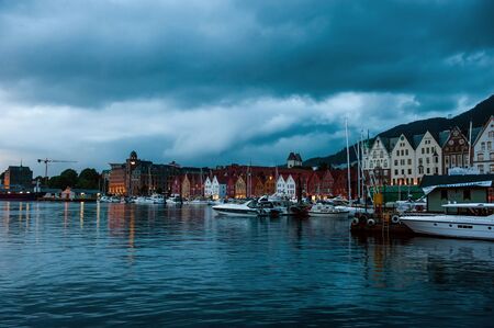 Bergen, Norway - July 30, 2013: Photo of Bergen Waterfront on a rainy evening. The coastline of the port of Bergen.のeditorial素材