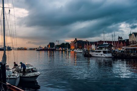 Bergen, Norway - July 30, 2013: Photo of Bergen Waterfront on a rainy evening. The coastline of the port of Bergen.のeditorial素材