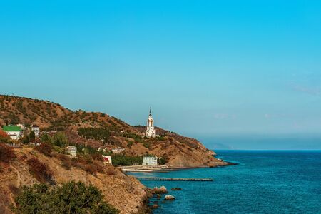 Temple lighthouse in honor of St. Nicholas on the seashore. Monument to the dead on the watersの写真素材