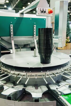 Conveyor for mechanical planting of seedlings.