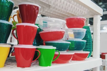 The products of plastic ware, subjects of care of plants on display in a supermarket. Replacement of...