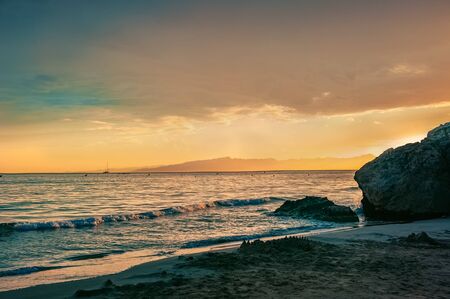 Dramatic sunset over the coastline after a thunderstorm.の写真素材