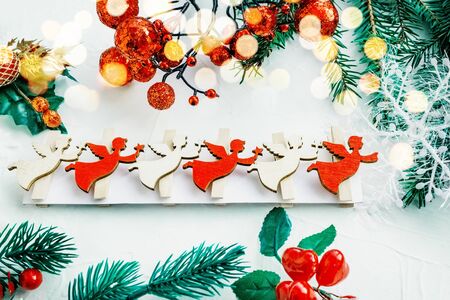 Set of decorations for the Christmas tree. Homemade figurines of Angels, wreaths and garlands will decorate the house for the holiday.の写真素材