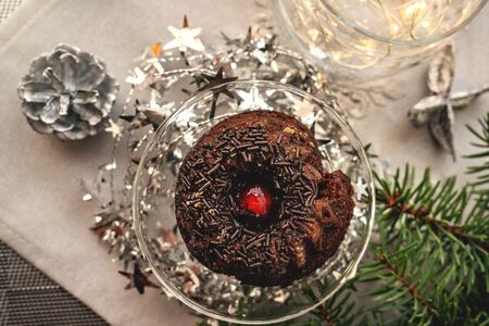 Chocolate mint cupcakes with sugar chocolate chips on the Christmas table.の写真素材