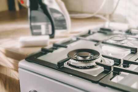Cleaning the stove after cooking. Gas burner without burning gas. Safe use of gas equipment. Selective focus. Close upの写真素材