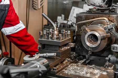 Master's hand. The old Metalworking machine, manufactured in the middle of the last century, is...