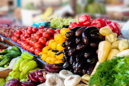 Demonstration of pepper tomatoes and other vegetables at the farmers  market. A stall with farmers ...