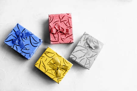 bunch of colorful Christmas gifts on a light uniform background top view. Copy space.の写真素材