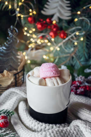 Hot chocolate with marshmallows on the Christmas table. Hot winter drinks in a cozy still life.の写真素材