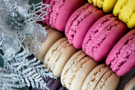 Colorful delicious macaroons in a row. Colorful macaroons cookies are in a gift box. Background, close-up, selective focus.の写真素材
