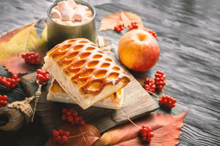 Classic American pie. Apple pie on the table. Apple and grape pie for Thanksgiving. Space for copyingの写真素材