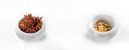 Spices anise and cardamom in a white stone mortar. copy space, bannerの写真素材