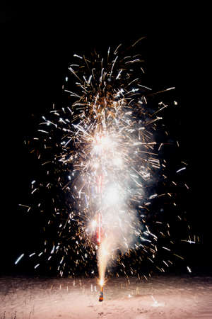 Fireworks in the backyard. Bright festive fireworks and sparkler on a black background. isolated....
