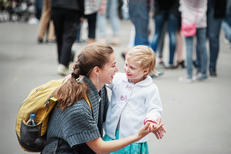 July 8, 2016. Kolomna, Moscow region, Russia. mother looks at her little daughter with love. love of parents and children. Family vacation in the park.のeditorial素材
