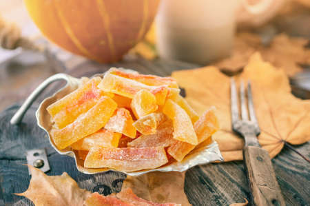 Preparation of natural farm homemade candied pumpkin fruits sprinkled with powdered sugar. Dried...