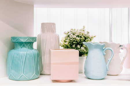 front view of various ceramic vases ceramic concept. Shelves with ceramic dishes in the pottery...