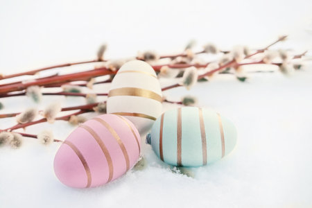 Beautiful decorative eggs with willow branches. symbol of Palm Sunday and Easter. Holiday greetings.