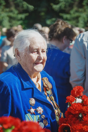 KOLOMNA, Moscow region, Russia May 9, 2014. Portrait of a veteran woman during the preparation of the march of the Immortal Regiment as part of the Victory Day celebrationのeditorial素材