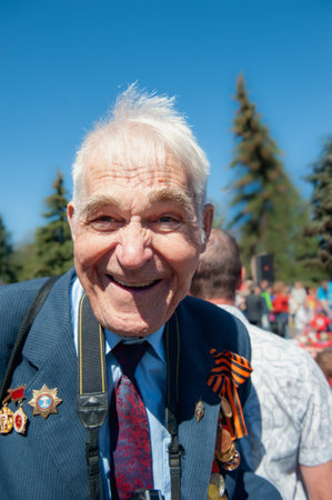KOLOMNA, Moscow region, Russia May 9, 2015. Portrait of a happy veteran with orders and medals. Immortal Regiment, Victory Day over Nazi Germanyのeditorial素材