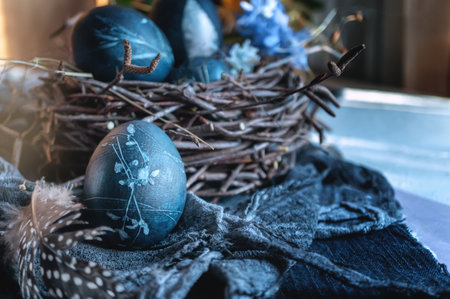 Blue Easter eggs. Eggs colored with karkade tea. Easter still life in a low key. Soft focus.の写真素材