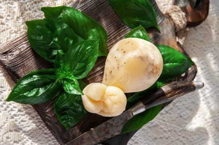 scamorza, Pasta Filata, Italian cheeses collection, smoked scamorza pear shaped cheese from small cheese farm in South Italy made from cow milk.の写真素材