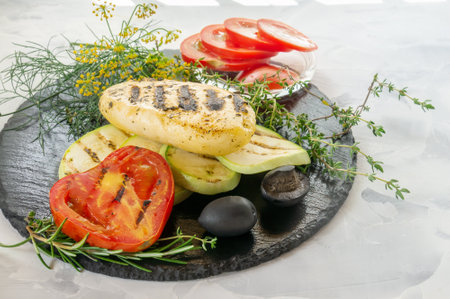 haloumi cheese with vegetables and thyme. Grilled barbecue cheese with tomatoes and zucchini. A dietary, low-calorie dish. Copy spaceの写真素材