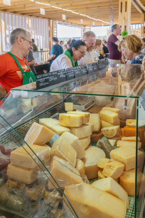 Istra, Russia, 04 August 2023. Farmers selling cheese of their own production. Cheese fair of farm products Cheese Pir Mir in Istra.のeditorial素材