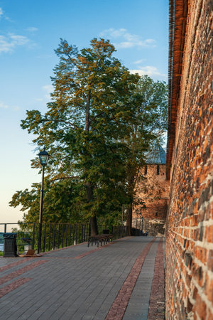 The wall and tower of the Nizhny Novgorod Kremlin in the rays of the setting sun. Sights and tourist routes of Nizhny Novgorod.のeditorial素材