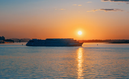 Cruise on the river. Cruise liner at sunset. Romantic sunset on the Volga and Oka rivers. Strelka in Nizhny Novgorod.の写真素材