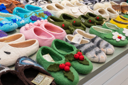 Nizhny Novgorod, Russia - May 29, 2023: felt shoes. Various options of felted shoes with handmade embroidery. Souvenir products in the store.のeditorial素材