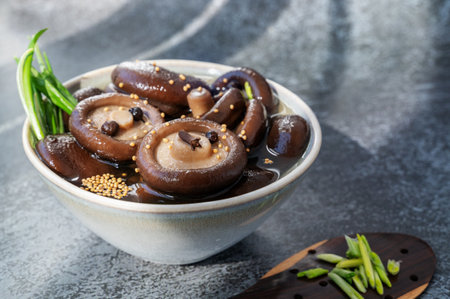 marinated shiitake. canned shiitake on a plate close-up.