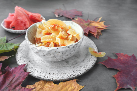 Homemade watermelon rind candy. Dessert from watermelon rinds in handmade earthenware.の写真素材