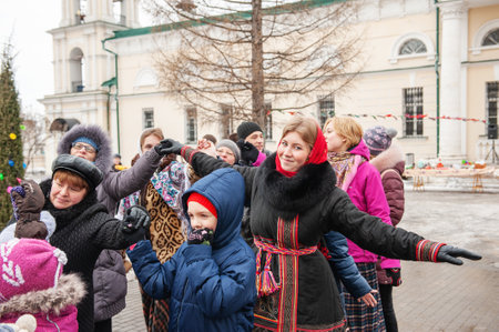 Kolomna, Moscow region. Russia February 22, 2015. Russian beauty in a round dance. A girl in a Russian national bright scarf. National dance - round danceのeditorial素材