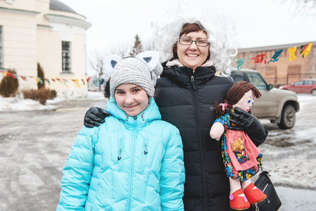 Kolomna, Moscow region. Russia February 22, 2015. Portrait of a middle-aged woman with her daughter at a holiday. Women in comic hatsのeditorial素材