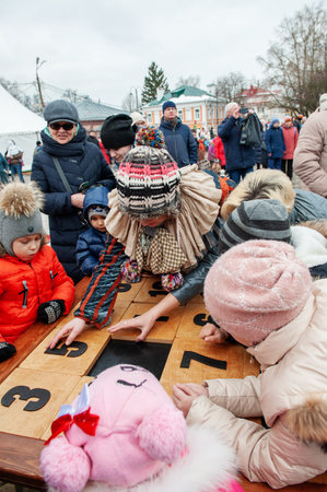 Kolomna, Moscow region, Russia March 10, 2019: Children celebrate Maslenitsa Maslenitsa - Russian holiday. People eat pancakes, play folk games, have fun during the winter, children play numbers and other gamesのeditorial素材
