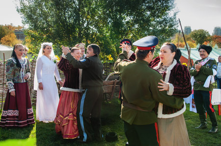 MOSCOW, RUSSIA - OCTOBER 1: Cossacks in national dress sing and dance at a festival. Cossacks at the fair and Cossack gathering. Scenes from everyday life of Cossacksのeditorial素材