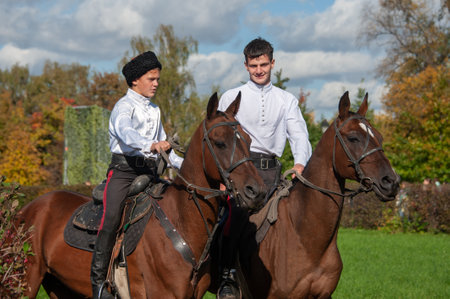 Moscow, Russia October 1, 2016: Cossack gathering. Portrait of young Cossacks on horseback. Equestrian group of Cossacks. National dress Cossacks. Scenes of Cossack lifeのeditorial素材