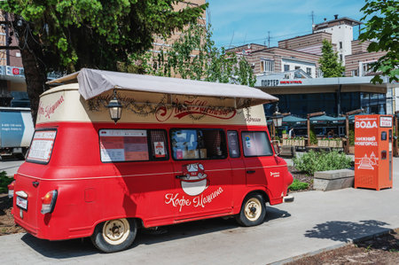 Nizhny Novgorod, Russia, May 30, 2023. A retro car is used to sell coffee on the street. The coffee machine was placed in a red Soviet retro car. Sights of Nmzhny Novgorodのeditorial素材