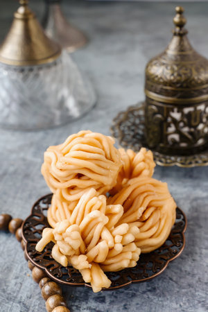 Muslim holiday sweets. Moroccan chebakia, chak-chak and handmade nath. Homemade Muslim sweet baked goods. Close-upの写真素材