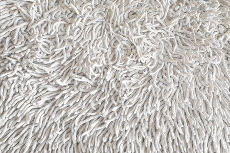 looped cotton fabric. Skeins of plush yarn for hand knitting with ready made loops. Background from a set of fleece curly threads. Yarn with loops. Needlework.の写真素材