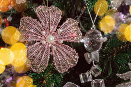 Glass toys on a Christmas tree. Festive empty glass transparent balloon. Winter season, holiday.の写真素材