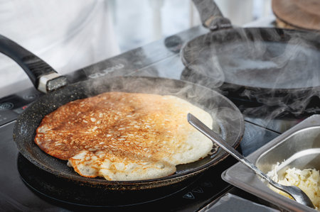 Pancakes are baked. Maslenitsa is a traditional Slavic holiday, pancakes are baked on the street....