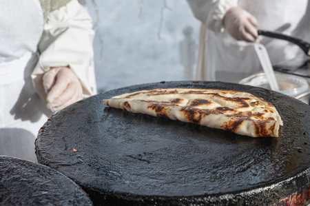 Pancakes are baked. Maslenitsa is a traditional Slavic holiday, pancakes are baked on the street.の写真素材