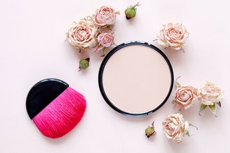 Decorative cosmetic: beige powder on light background, top viewの写真素材